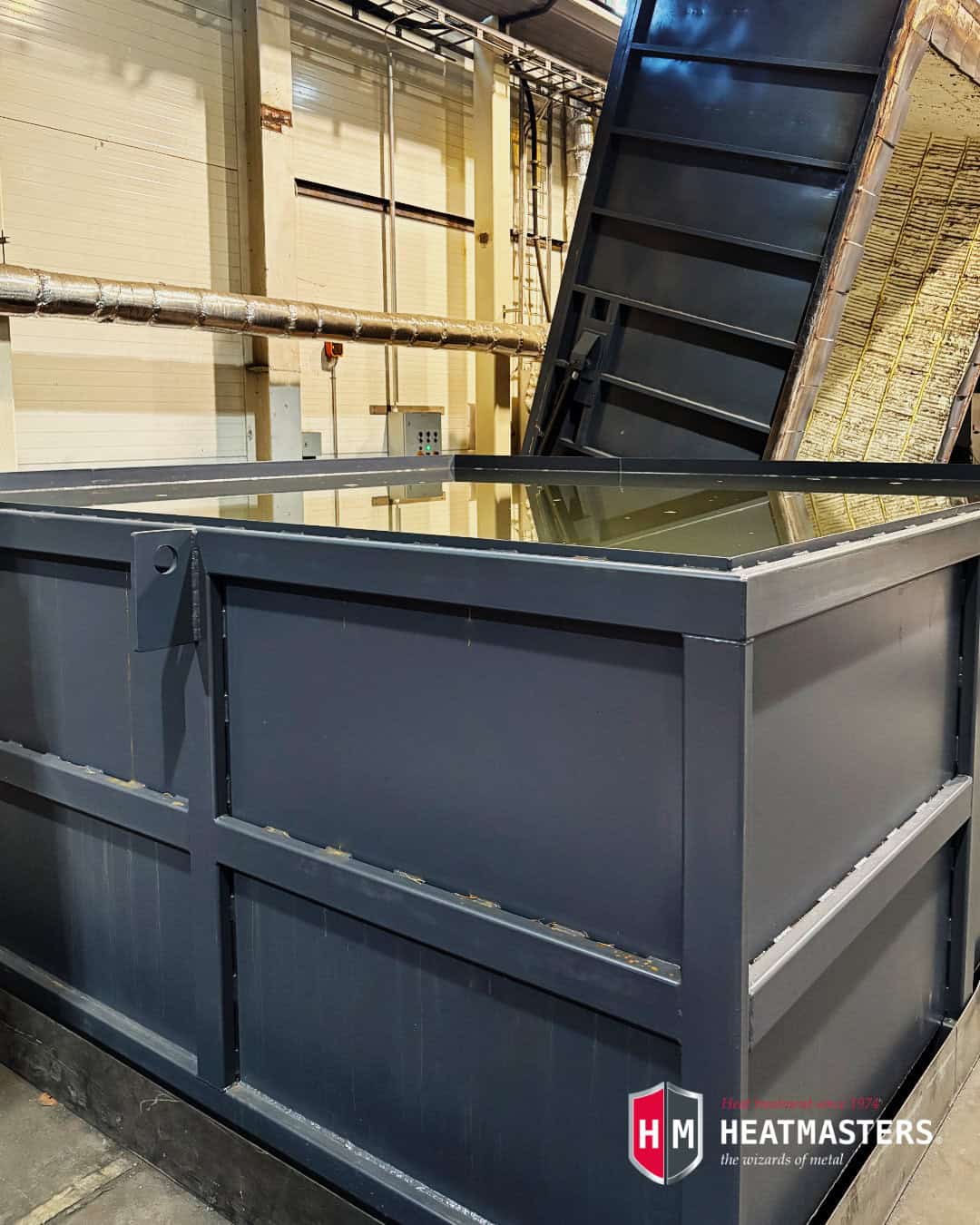Industrial quenching pool at Heatmasters Service Center used for controlled cooling in metal heat treatment
